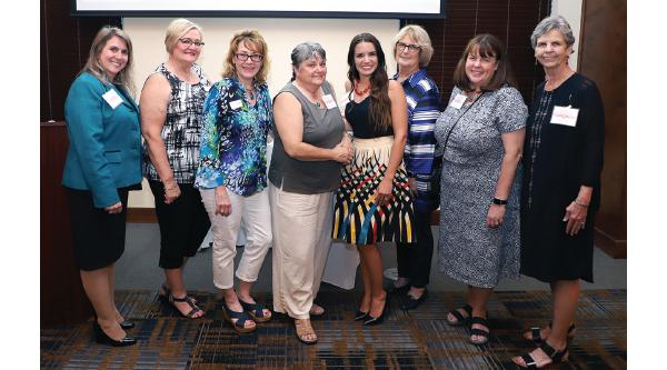 Women's Giving Circle grant recipients pose with members of the Crown Point Community Foundation. Pictured from left to right: CPCF Board Members Chrisanne Christ and Marilyn Kaper; CPCF President Mary Nielsen; Bonnie Meyer, Director of Outreach and Missions at Crown Point First United Methodist Church; Lauren Mauk, Mommy's Haven President; and Katherine Chariton, Julie Wendorf and Bette Oesterle from the Crown Point Rotary Club Dolly Parton Imagination Library Committee.