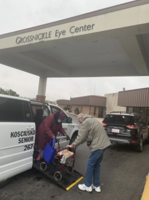 Driver assists Kosciusko Community Senior Services member for Grossnickle Eye Center appt.