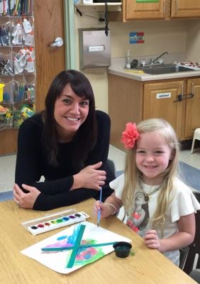 Brooke Ridenour of Heaven Sent Preschool and Day Care with Achaiah McCue. Heaven Sent is one of many Steuben County programs working to take advance on Indiana's state rating system, Paths to QUALITY™